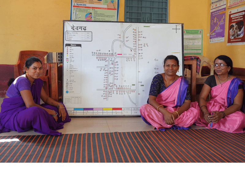 AAA workers with a village map in Chhindwara, MP