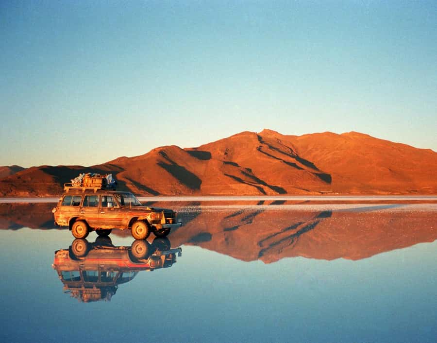 A jeep reflected on the salt flats of Bolivia