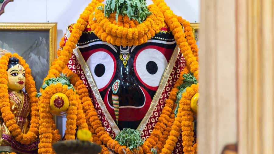 A marigold-garlanded Jagannath idol, Odisha